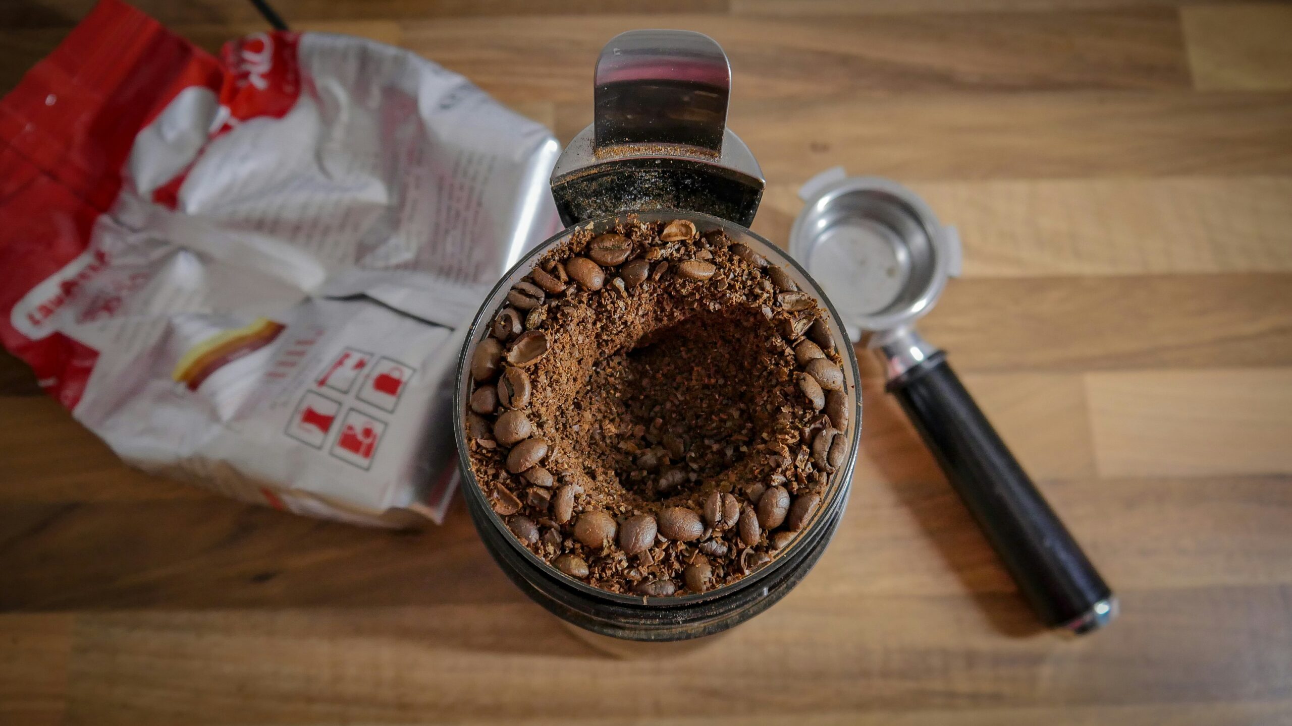 Turmeric paste being added to dog food bowl