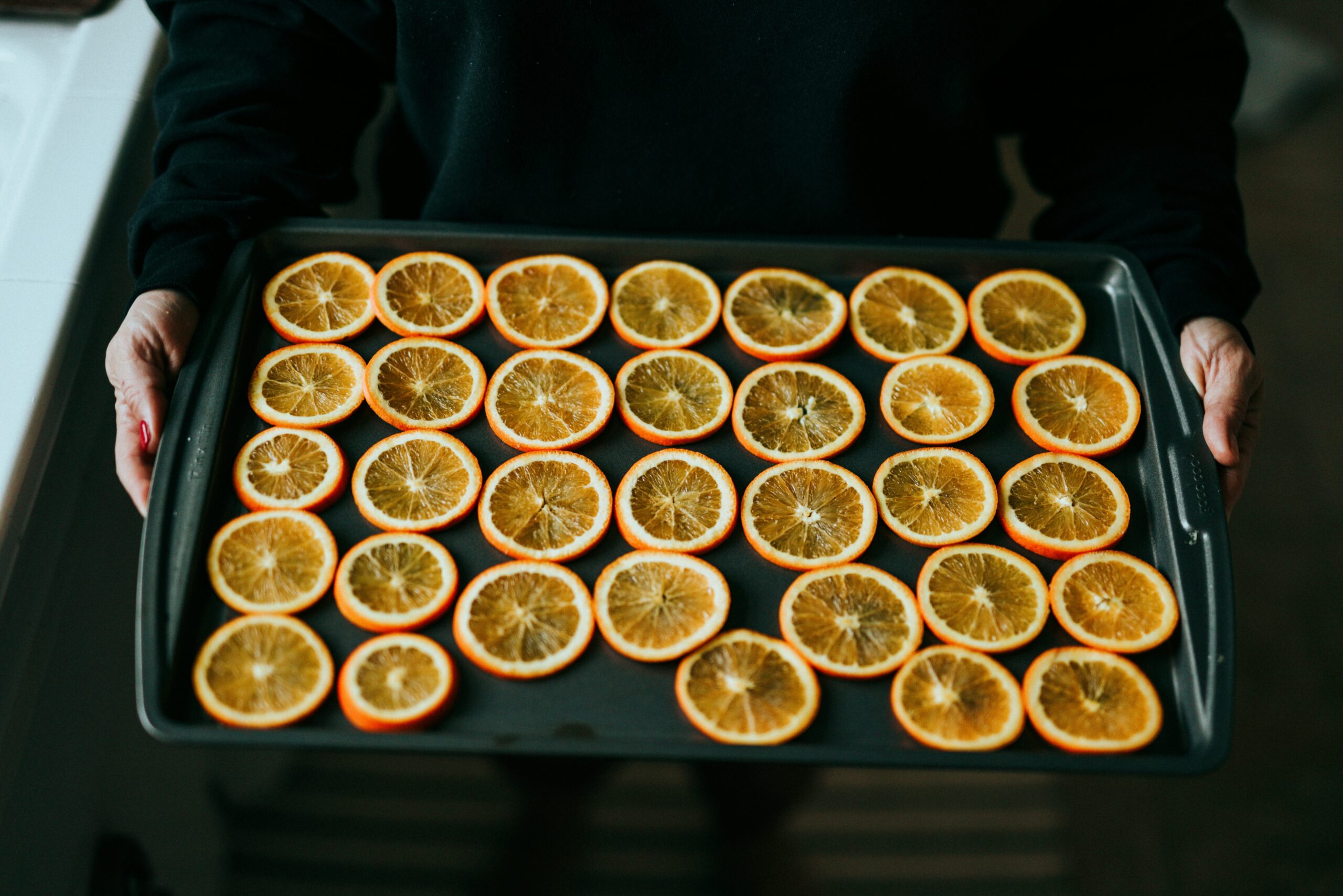 A bowl of golden turmeric powder with measuring spoons nearby